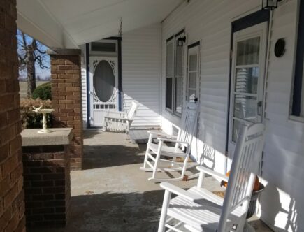 Margrets Side Porch with Swings looking west